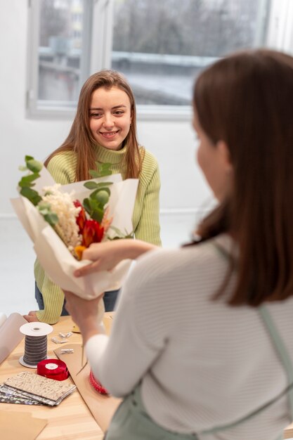 Women creating a bouquet of flowers