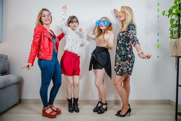 Women dancing in different glasses