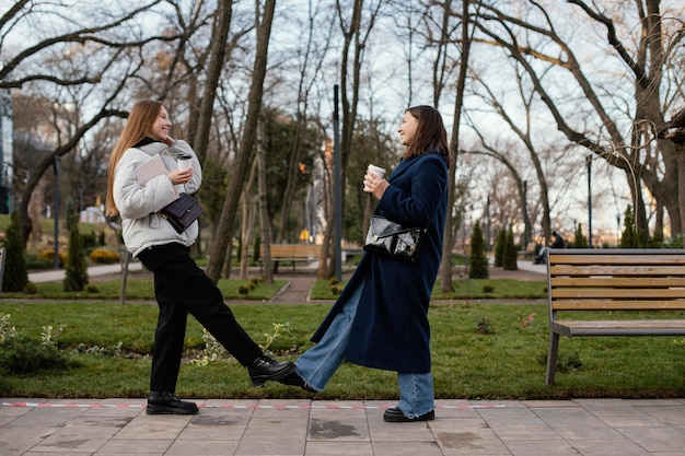 Free Photo women doing foot touch