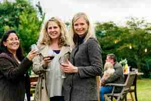 Free photo women drinking wine together