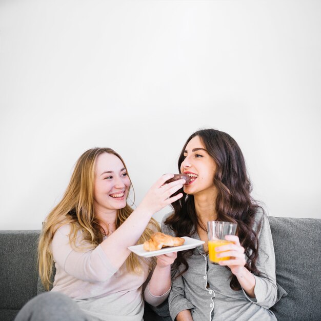 Women eating pastry for breakfast