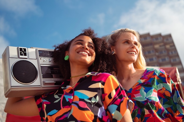 Free Photo women enjoying 80s summer aesthetics