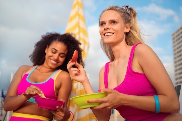 Women enjoying 80s summer aesthetics