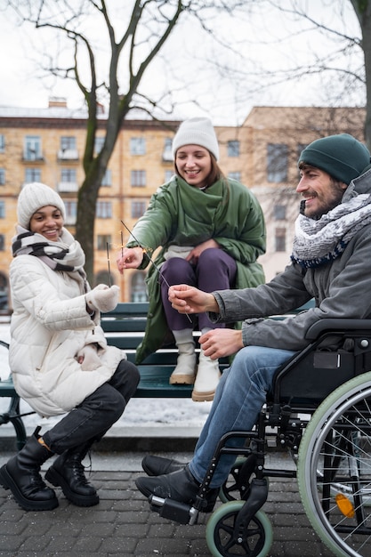 Free Photo women enjoying time with their friend in wheelchair