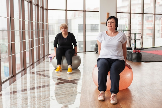 Women exercising on balls