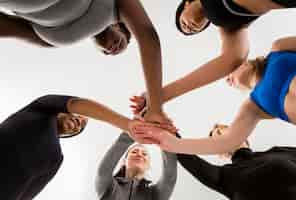 Free photo women at fitness class shaking hands