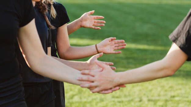 Women hands saluting before a match