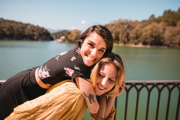 Women having fun near river