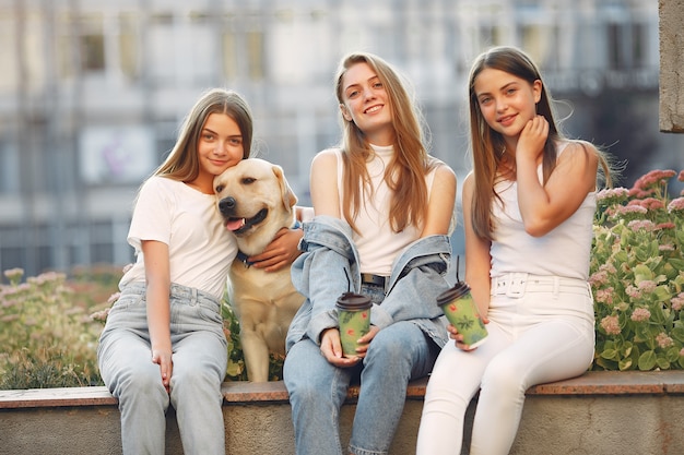 Free photo women having fun in the street taking a coffee