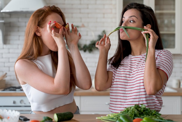 Women having fun while preparing a meal