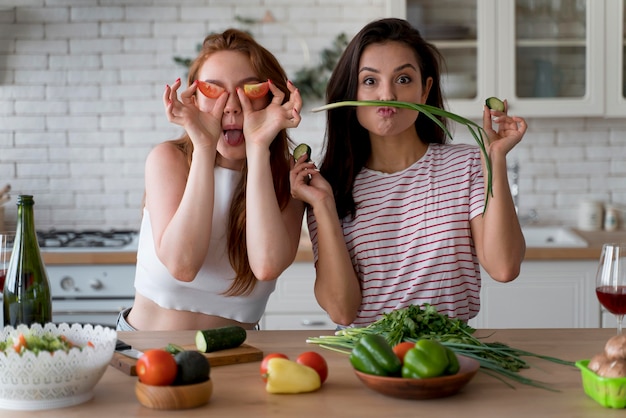 Free Photo women having fun while preparing a meal