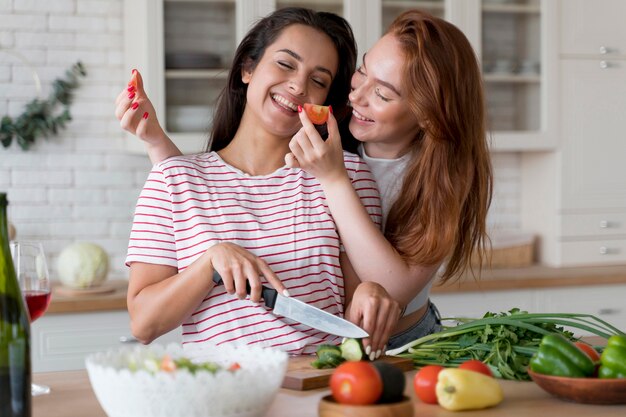 Women having fun while preparing a meal