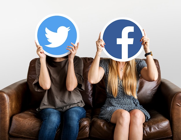 Free photo women holding social media icons