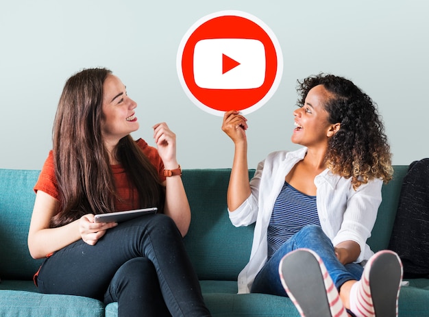 Free photo women holding a youtube icon