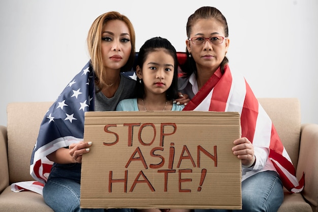 Women and kid with placard