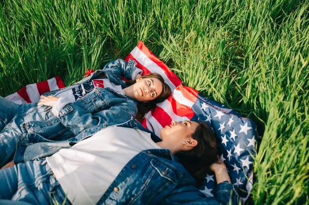 Women lying on American flag