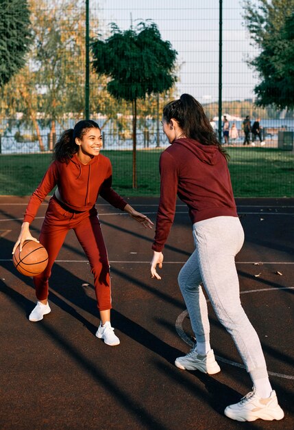 Women playing together a basketball game