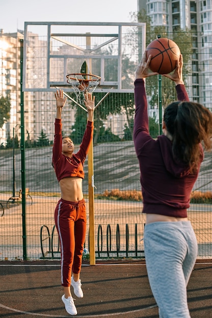 Women playing together basketball