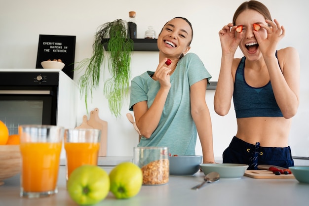 Women preparing healthy meals front view