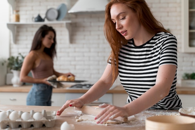 Women preparing together a romantic dinner