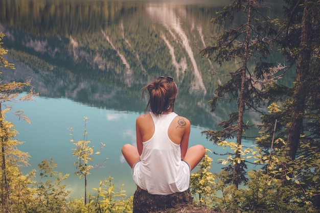 Free photo women's white tank top on top of the hill