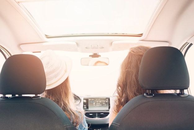 Free photo women sitting in car