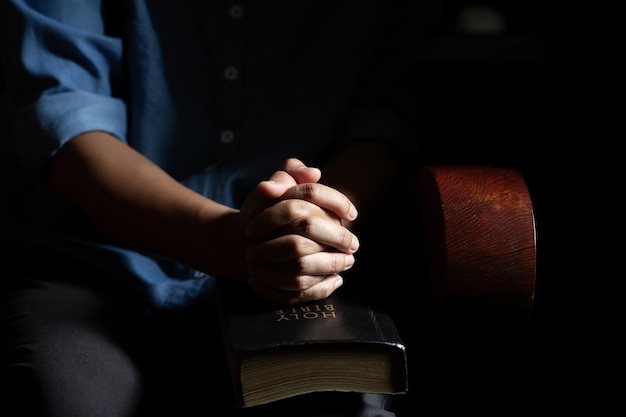 Women sitting in prayer in the house