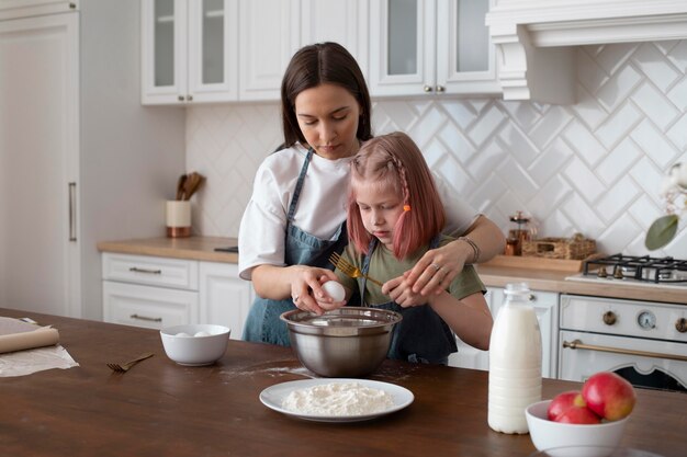 Women spending time together with their daughter at home