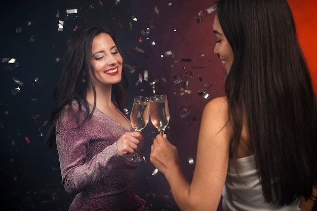 Women toasting with champagne at new years party