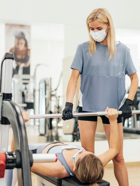 Free photo women training at the gym during the pandemic