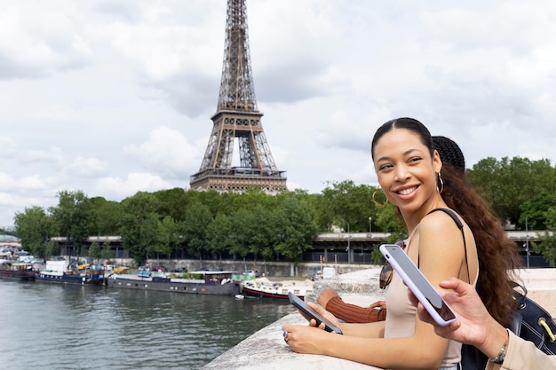 Free Photo women traveling together in paris