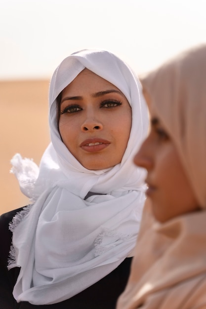 Women wearing hijab in the desert