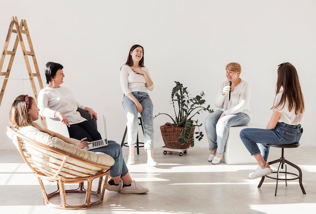 Free photo women in white shirts spending time together