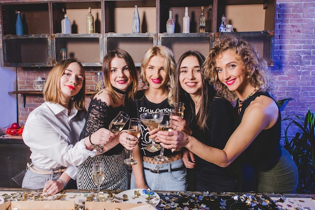 Free Photo women with champagne on kitchen