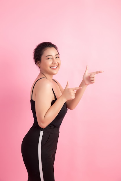 women with white empty board, pointing away