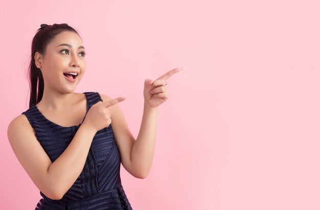 women with white empty board, pointing away