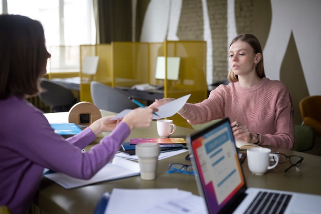 Free Photo women working together at office