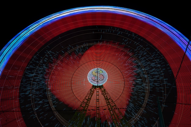 Free photo wonder wheel movement red lights with light bulb