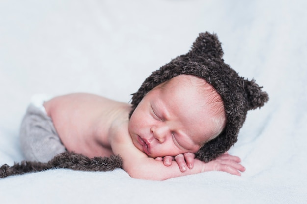 Free photo wonderful tiny child in bear hat