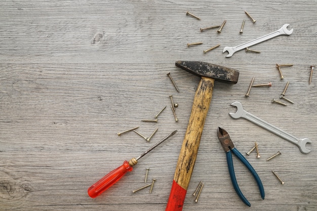 Wooden background with variety of tools for father's day