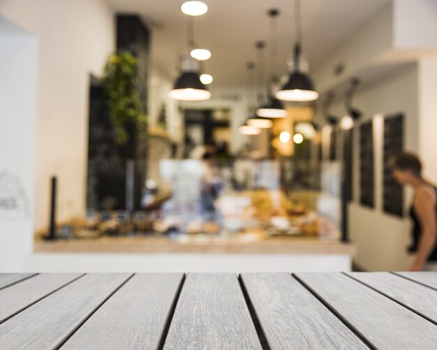 Free Photo wooden board looking out to bar scene