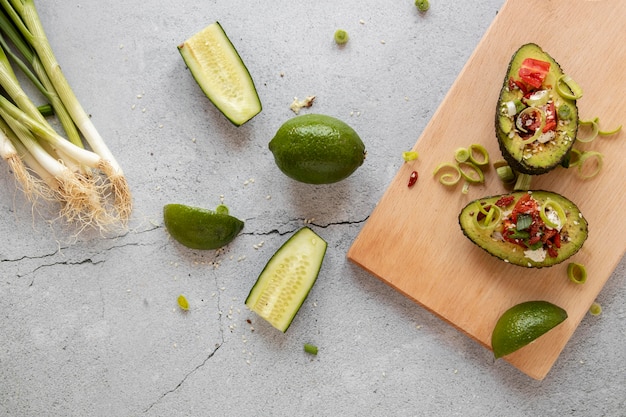 Wooden board with avocado salad