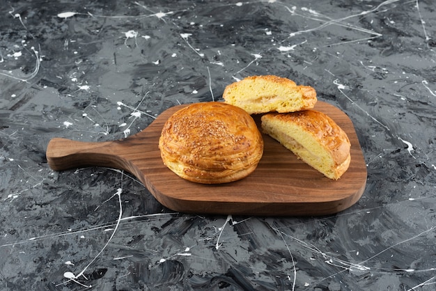 A wooden board with Azerbaijan national pastry on a marble surface 