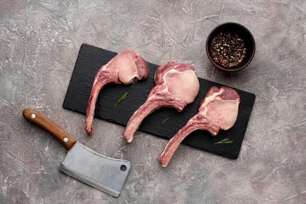 Wooden board with raw meat