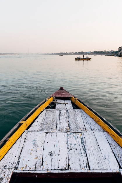 Free photo wooden boat sailing on the river ganges in varanasi, india