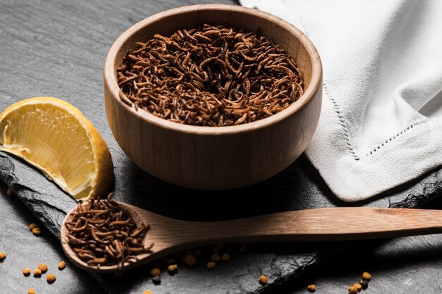 Wooden bowl filled with delicious bugs