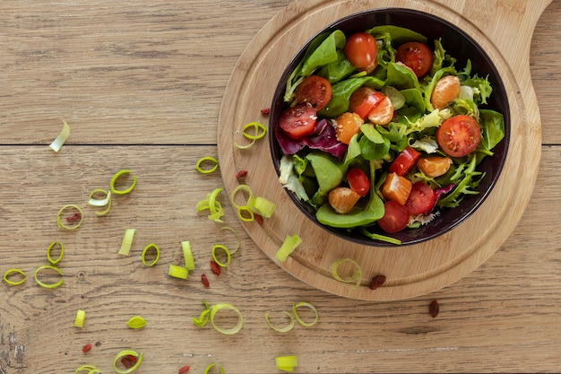 Wooden bowl with salad