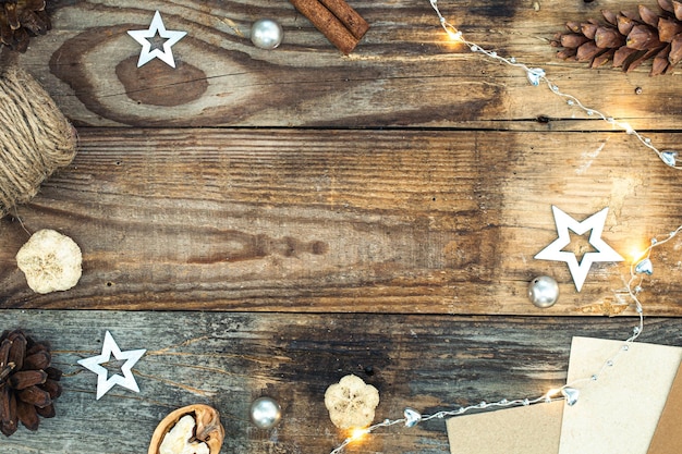 Free photo wooden christmas background with decor details flat lay