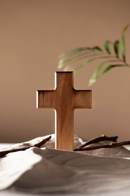 Wooden cross, branches and sand assortment