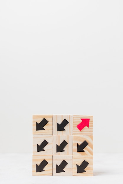 Free Photo wooden cubes with arrows originality concept